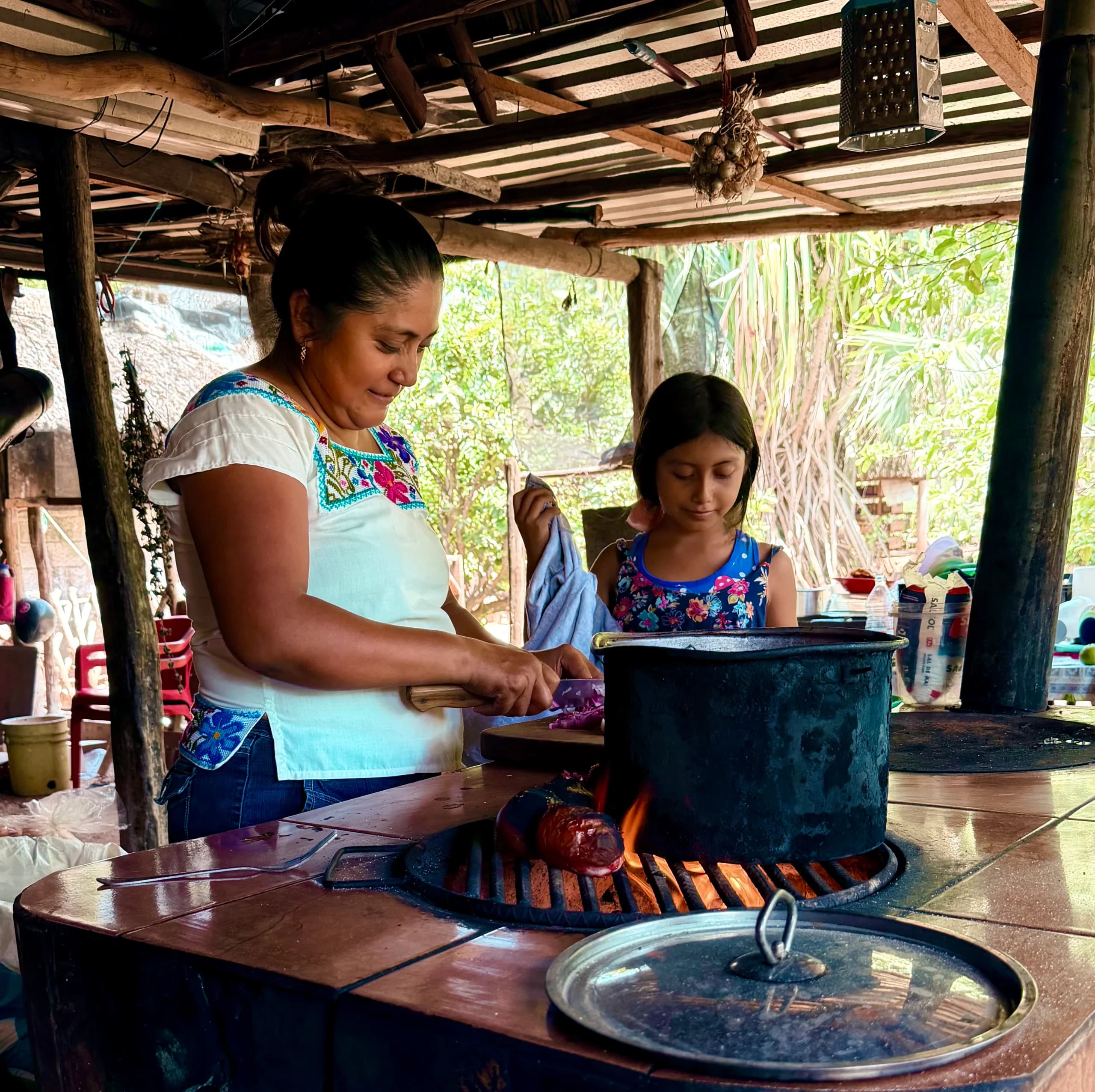 Fátima cooking in her kitchen in Maní